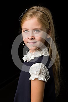 Close Up View of Cute Smiling Blonde Girl Posing on Black Background