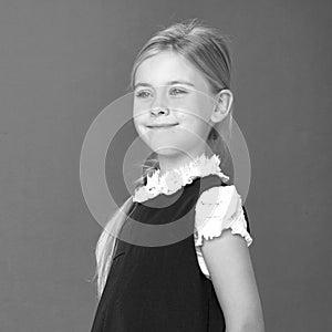 Close up view of cute smiling blonde girl posing.Black white photo.