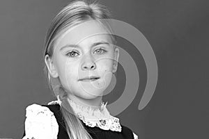 Close up view of cute smiling blonde girl posing.Black white photo.