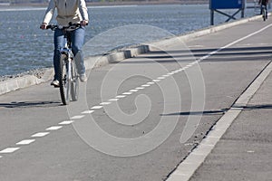 Close-up view on a cyclist on the road
