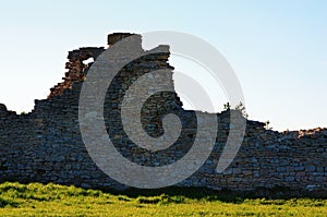 Close-up view of defensive wall in ancient Krements castle. Beautiful spring evening. Blue sky in the background