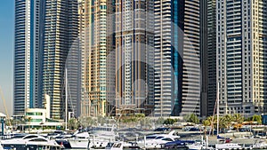 Close up view of Dubai Marina tallest towers in Dubai at day timelapse