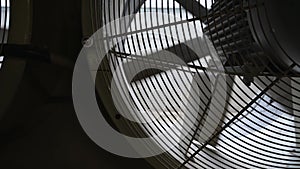 Close-up view of dusty fan blades. Large fan with slow rotating blades