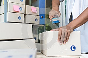 Close up view of ecommerce business owner preparing goods to  deliver