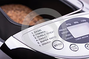 Close-up view of electric bread maker digital display