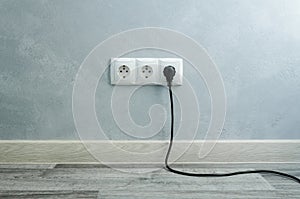 Close-up view of electric outlets with power cables