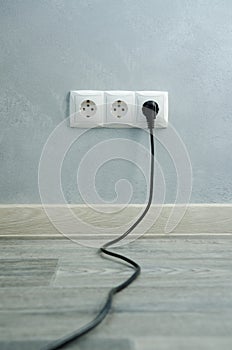 Close-up view of electric outlets with power cables