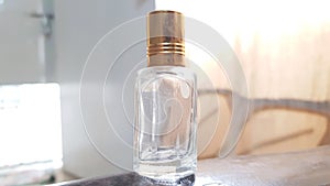 close up view of an empty oud attar oil glass bottle