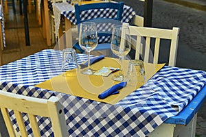 Close up view of empty quaint little restaurant with tables set on the sidewalk