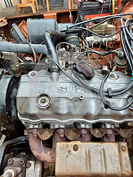 Close-up view of engine bay of a suzuki katana car.