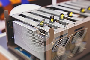Close-up view of equipment for bitcoin cryptocurrency mining farm, electronic devices with fans, concept of mining technology