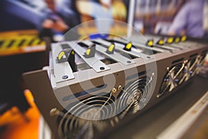 Close-up view of equipment for bitcoin cryptocurrency mining farm, electronic devices with fans, concept of mining technology