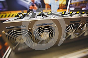 Close-up view of equipment for bitcoin cryptocurrency mining farm, electronic devices with fans, concept of mining technology