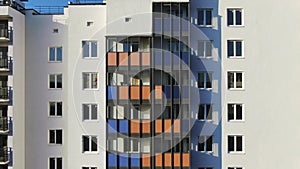 Close-up view facade of the beautiful colourful of a tall residential building. Motion. High-rise buildings modern