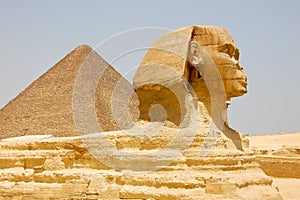 Close-up view of the famous Sphinx of Giza, with the Great Pyramid in the background, in Cairo, Egypt.