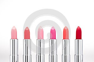 Close-up view of fashionable glossy lipsticks set photo