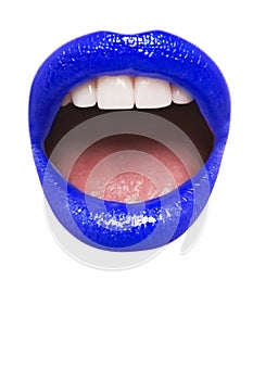 Close-up view of female wearing dark blue lipstick with mouth open over white background