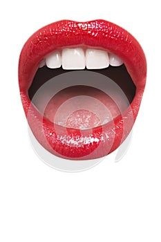 Close-up view of female wearing red lipstick with mouth open over white background