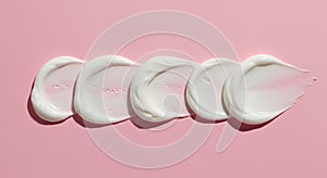 Airy White Foam Mousse Texture on Pink Background photo