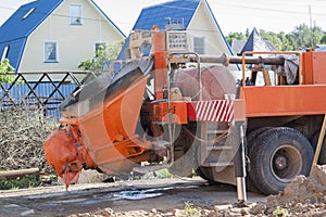 close up view of the flowing concrete from concrete mixer machin