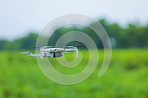 Close up view of flying drone over agriculture field