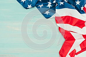 Close up view of folded american flag on blue wooden tabletop