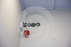 Close up view of four cable channels for cabling, wiring in wall and fire alarm.