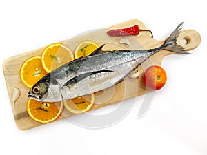 Close up view of fresh Finletted Mackerel Fish or Torpedo Scad Fish decorated with herbs.White background,Selective focus