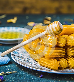 Close-up view of fried pastry coated in honey