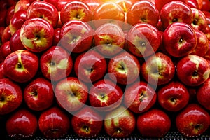 Close up view of fruits shelf in supermarket. Apple background