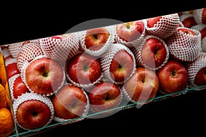 Close up view of fruits shelf in supermarket. Apple background