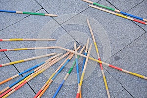 Close-up view of the game of pick-a-stick, commonly known as jackstraws, set up on a city street