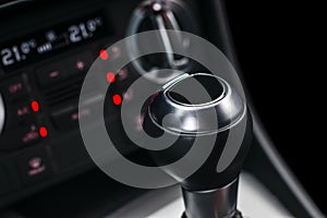 Close up view of a gear lever shift. Manual gearbox. Car interior details. Car transmission. Soft lighting. Abstract view. Car det