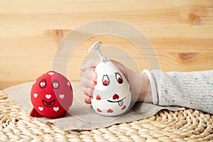 Close up view of girl child hand squeezing white homemade stress ball, made with flour and balloon.