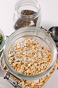 Close-up view of a glass jar full of rolled oats