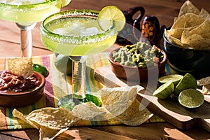 Margaritas with nachos and guacamole. photo