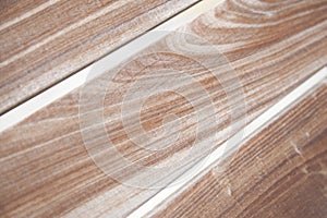 Close up view of grainy wooden bench planks