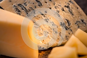 Close up view of Grana Padano and Dorblu cheese