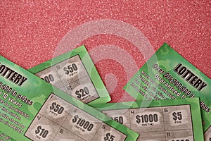 Close up view of green lottery scratch cards. Many used fake instant lottery tickets with gambling results. Gambling addiction