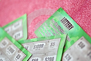 Close up view of green lottery scratch cards. Many used fake instant lottery tickets with gambling results. Gambling addiction