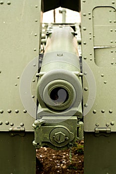 Close up view of a green vintage cannon from the first world war