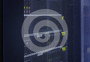 Close up view grid door of modern mainframe in high tech internet data center abstract . Server hardware, networking