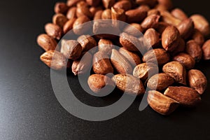 Close up view of groundnuts groups on black background