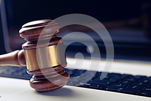 Close up view of a hammer and a computer keyboard