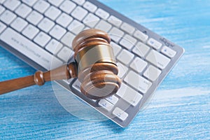 Close up view of a hammer and a computer keyboard