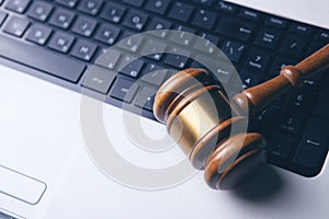 Close up view of a hammer and a computer keyboard