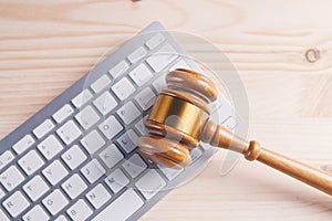 Close up view of a hammer and a computer keyboard