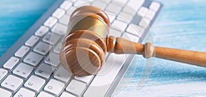 Close up view of a hammer and a computer keyboard