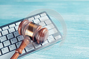 Close up view of a hammer and a computer keyboard