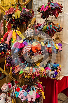 Close-up view of the handmade elephant key chain selling at the souvenirs stall at Chatuchak weekend market in Bangkok